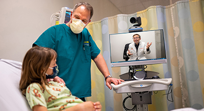 James Marcin with pediatric patient