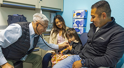Dr. Frank Ing with pediatric cardiology patient Grace and her family