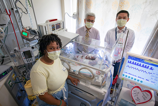 Frank Ing, Jay Yeh and Candra Taylor with baby Cedric.