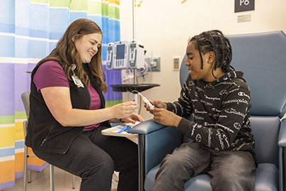 A healthcare worker and child patient.