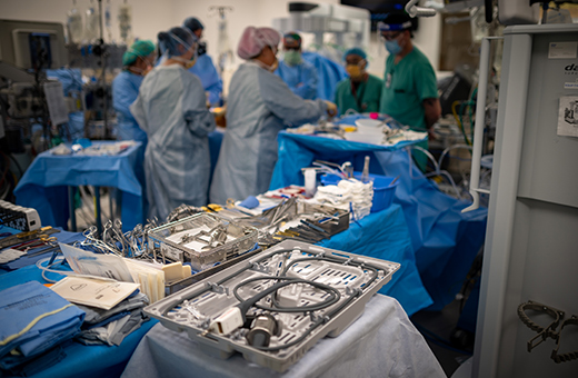 Surgeons implanting pacemaker.