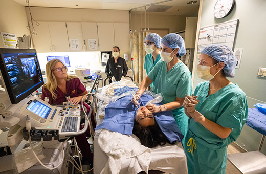 Surgeons performing thyroid nodule ablation.
