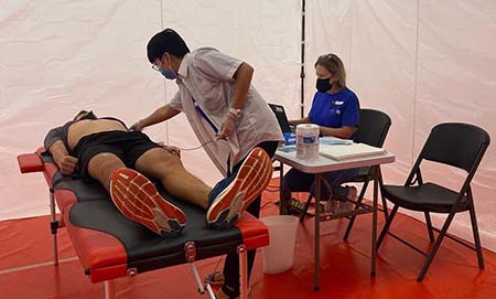 A young person receives an electrocardiogram.
