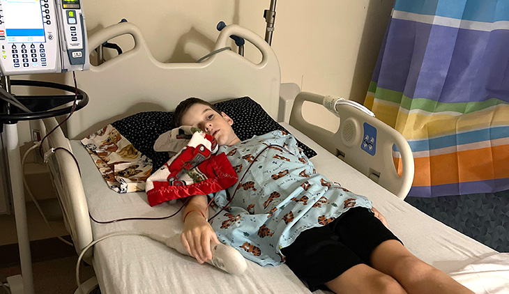 young male in a hospital bed