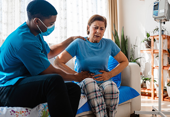 Woman clutching her stomach in pain