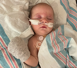 Ellie in a hospital bed