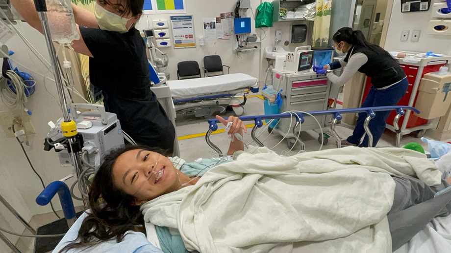 Woman lying in hospital bed. 
