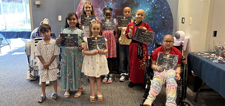 8 children hold certificates