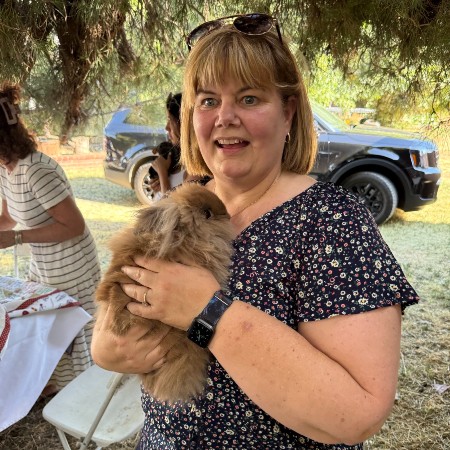 Megan Lunsford holds one of the fuzzy rescue animals from MimiZ Petting Zoo