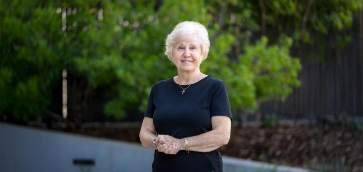 Else Carr wearing a black shirt and standing at an angle.
