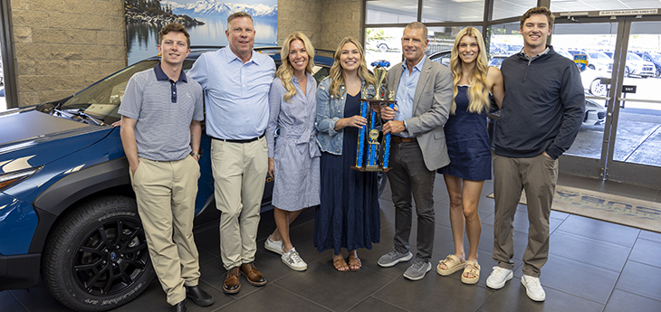 Dr. Randall presenting family with trophy