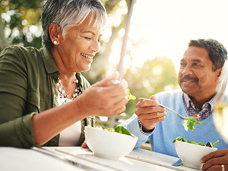 older couple eating a salad