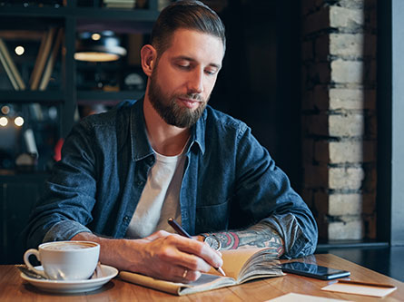 man journaling to help manage his anxiety