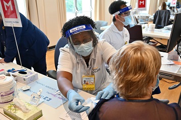 Master’s Entry Program in Nursing students providing vaccines 