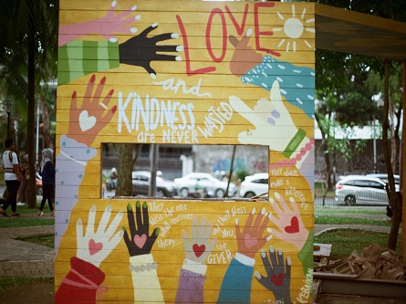 mural with different colored hands with hearts in the middle of them