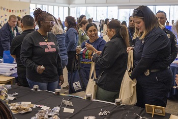 attendees visit booths during the opening day resource fair