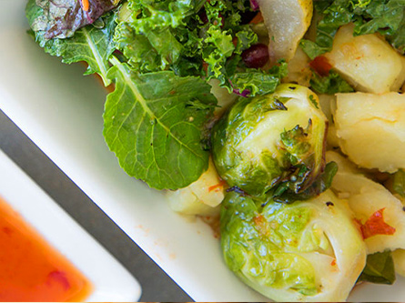 Roast sweet potatos and brussel sprouts with side dressing