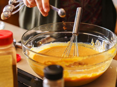 pre-pumpkin pie mixture being mixed together