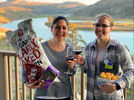 Two nutritionists with healthy snacks