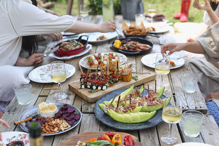 people eating at a picnic table