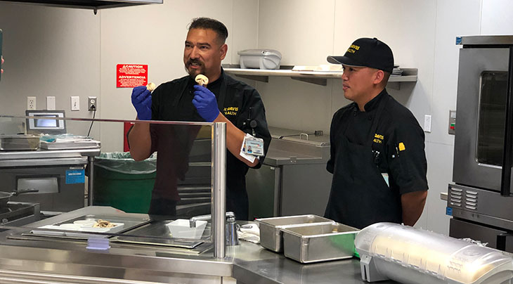 Chefs Santana Diaz and Jet Aguirre in the kitchen