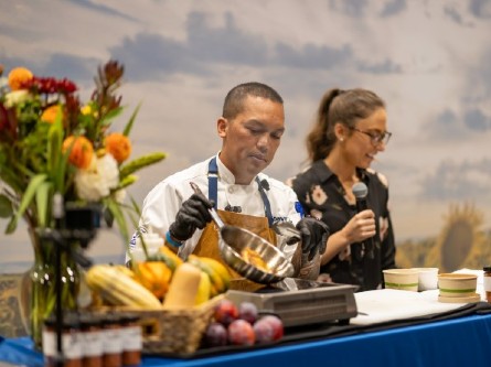A UC Davis Health chef cooking chicken in a demo