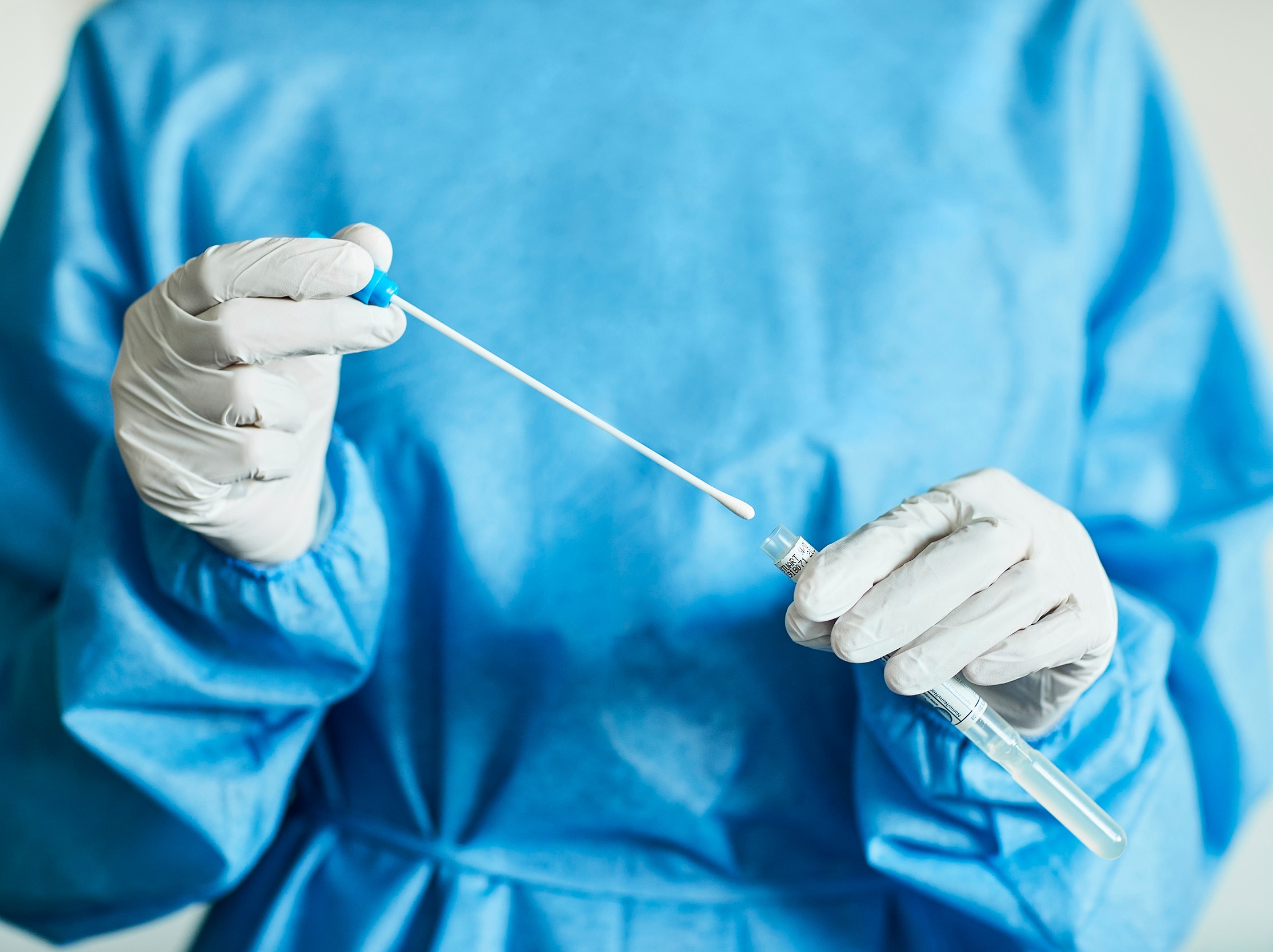 healthcare provider holding swab