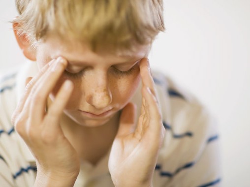 kid with headache
