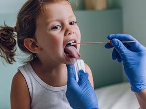 girl getting throat swab