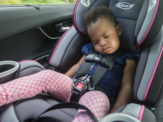 kid sleeping in carseat