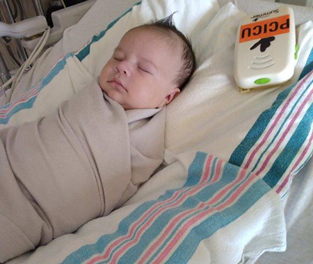 JJ sleeping in his crib.