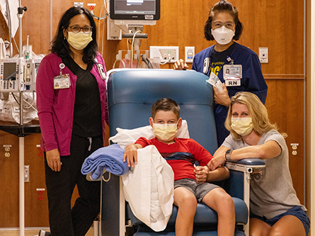 Adam Olson, his mom and Dr. Say