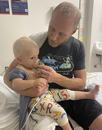 Shea with her dad in the hospital.