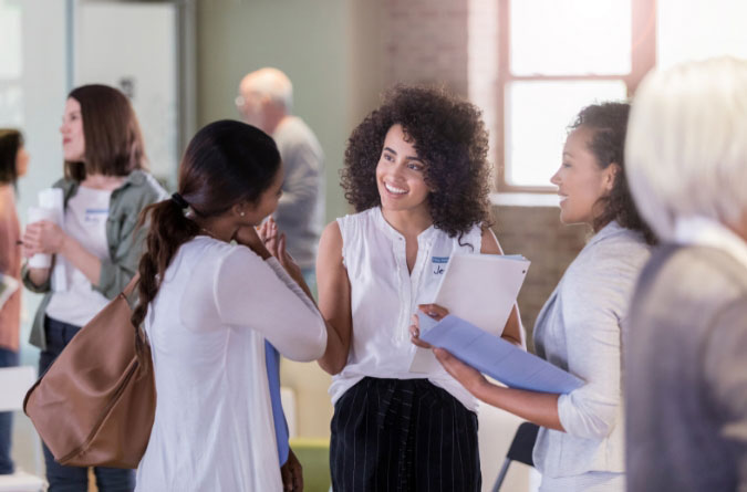 group of women in conversation in business setting 