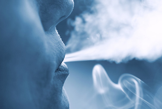 Person blowing smoke