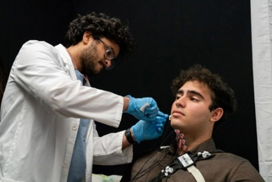 Researcher placing electrodes 