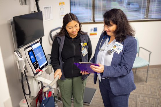 Doctor and fellow in discussion.
