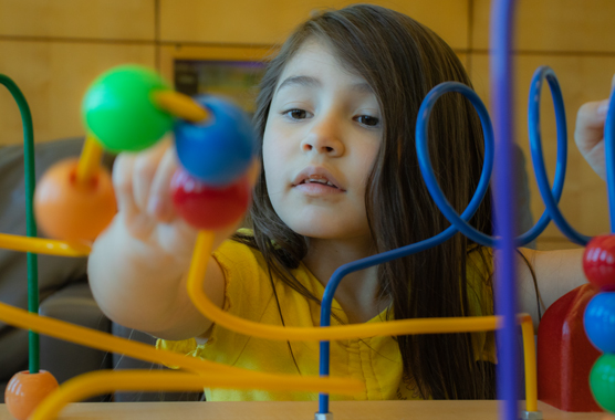 girl playing with toys