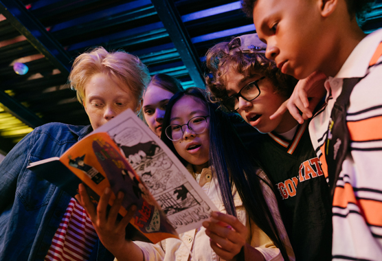 teens enjoying themselves at an arcade