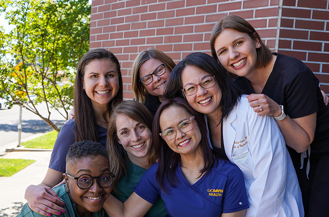 multidisciplinary team smiling at the Parkinson's Foundation COE at UC Davis