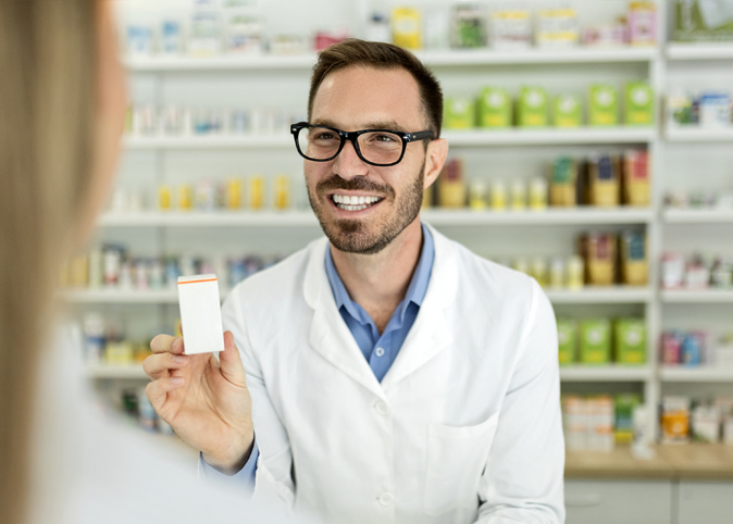 pharmacist explains prescription to patients