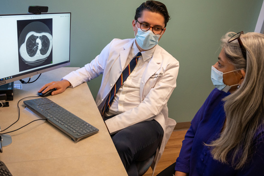 Doctor reviewing lung CT scan.