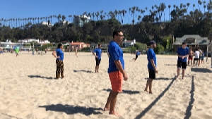 Residents playing volleyball at the beach