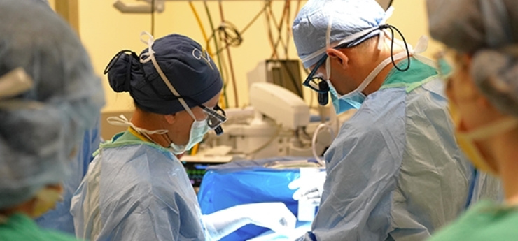 surgeon and resident observing the surgery