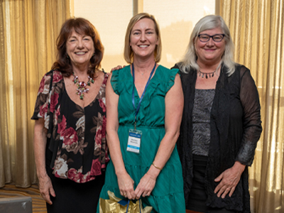 Sheridan Miyamoto, center, celebrates the completion of her fellowship program at Convocation 2023 with Susan C. Reinhard, left, visiting professor with the fellowship program and Fellowship National Advisory Council member, and Heather M. Young, right, fellowship national program director. (c) UC Regents. All rights reserved.