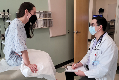 Doctor examining a patient. (c) UC Davis Regents. All rights reserved.