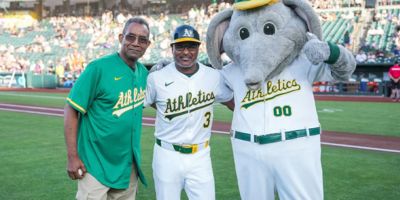 Two baseball players with a mascot (c) UC Regents. All rights reserved.