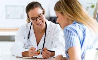 Woman at a doctor's appointment (c) UC Regents. All rights reserved.